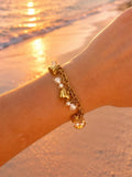 Bracelet Bianca doré en acier inoxydable waterproof porté au poignet
